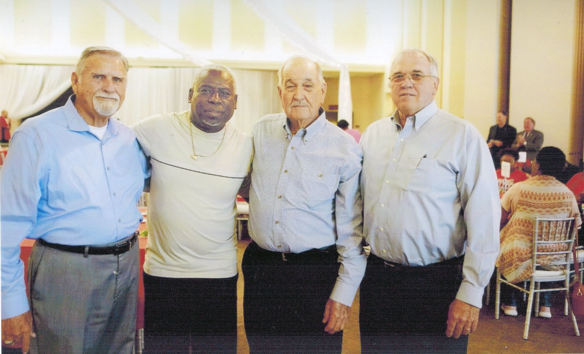 Former Quitman coaches joined Kelvin Russell at the 2018 Navarro College (Corsicana) Alumni Luncheon Oct. 18 where Russell was the featured speaker. They are (left to right): David Seago, Kelvin Russell, Don Neighbors and Orval Lindsey. (Courtesy photo)