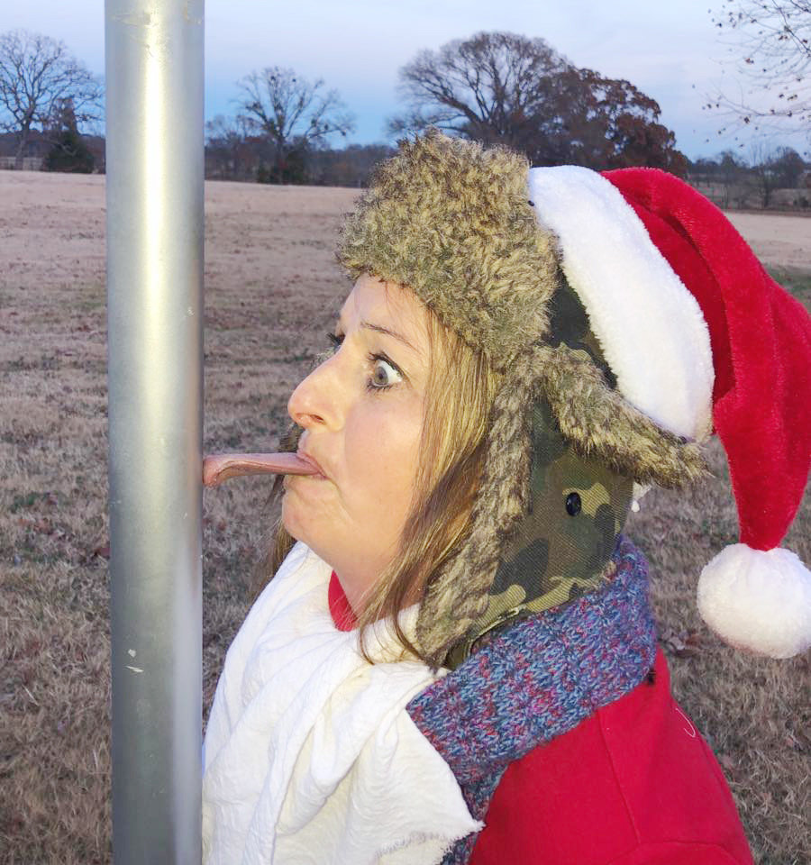 Teri Curts recreates an iconic scene from "A Christmas Story" as part of her holiday elf photographs.