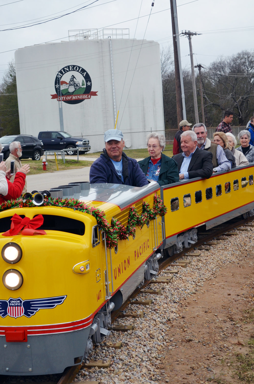 The Harry Meredith Special made its inaugural run last week at Iron Horse Square Park in Mineola. The miniature train will be a permanent fixture at Iron Horse Square Park on West Front Street. Among the first passengers aboard the train were members of the Meredith Foundation, which committed $129,942 for the project, and Brian Steck, whose ETAS Metal Roof & Wall Systems designed the train barn and donated materials for it. The engineer was Glen Thurman, a local contractor who supervised the construction of the track.