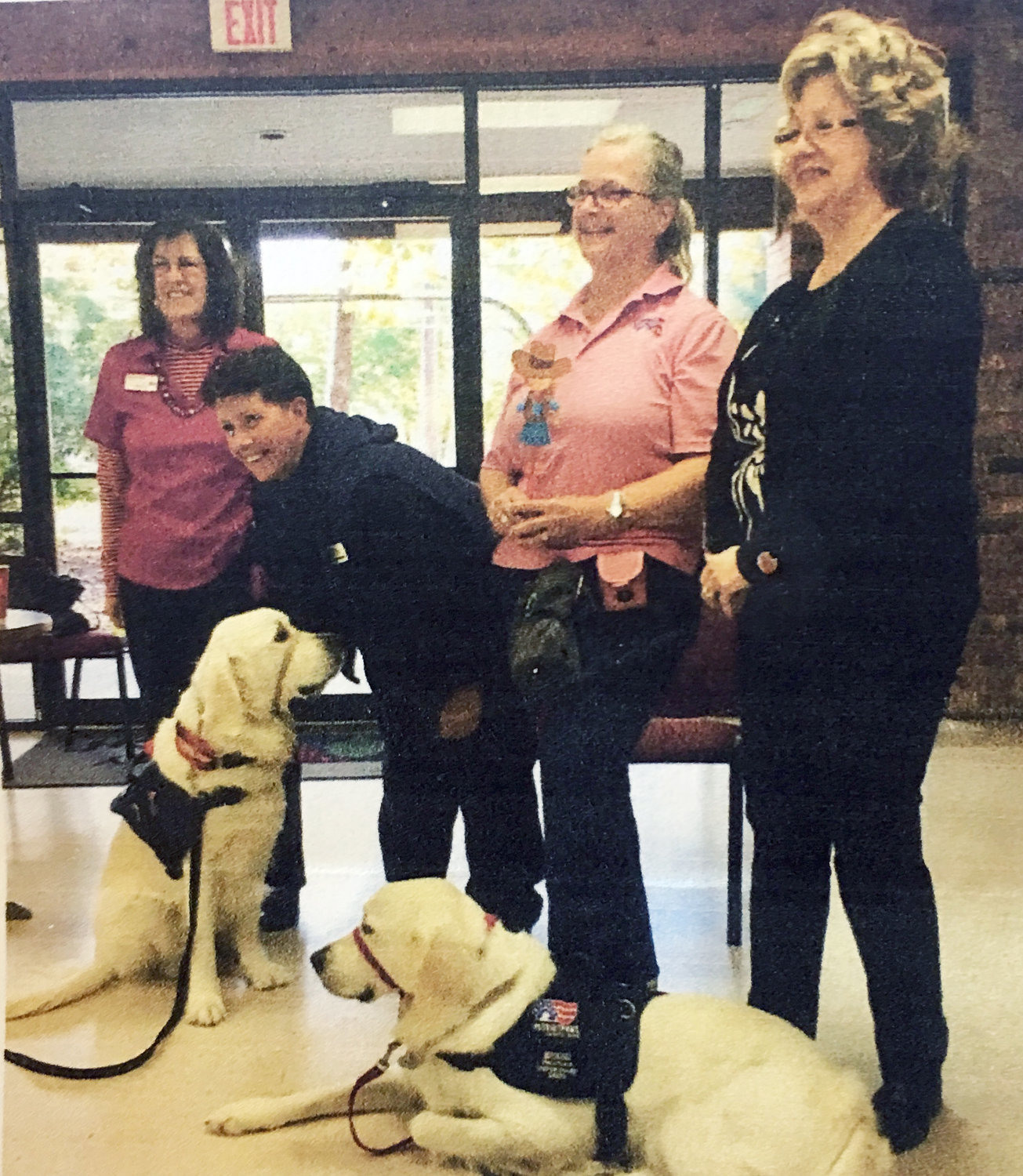 From left are Sylvia Yates (Patriot Paws), Carolyn Simmons (regent, John Hogg Sr. Chapter, NSDAR), Chris Davis (Patriot Paws), Joan Smith (second vice regent), Maverick and Woody (service dogs in training).