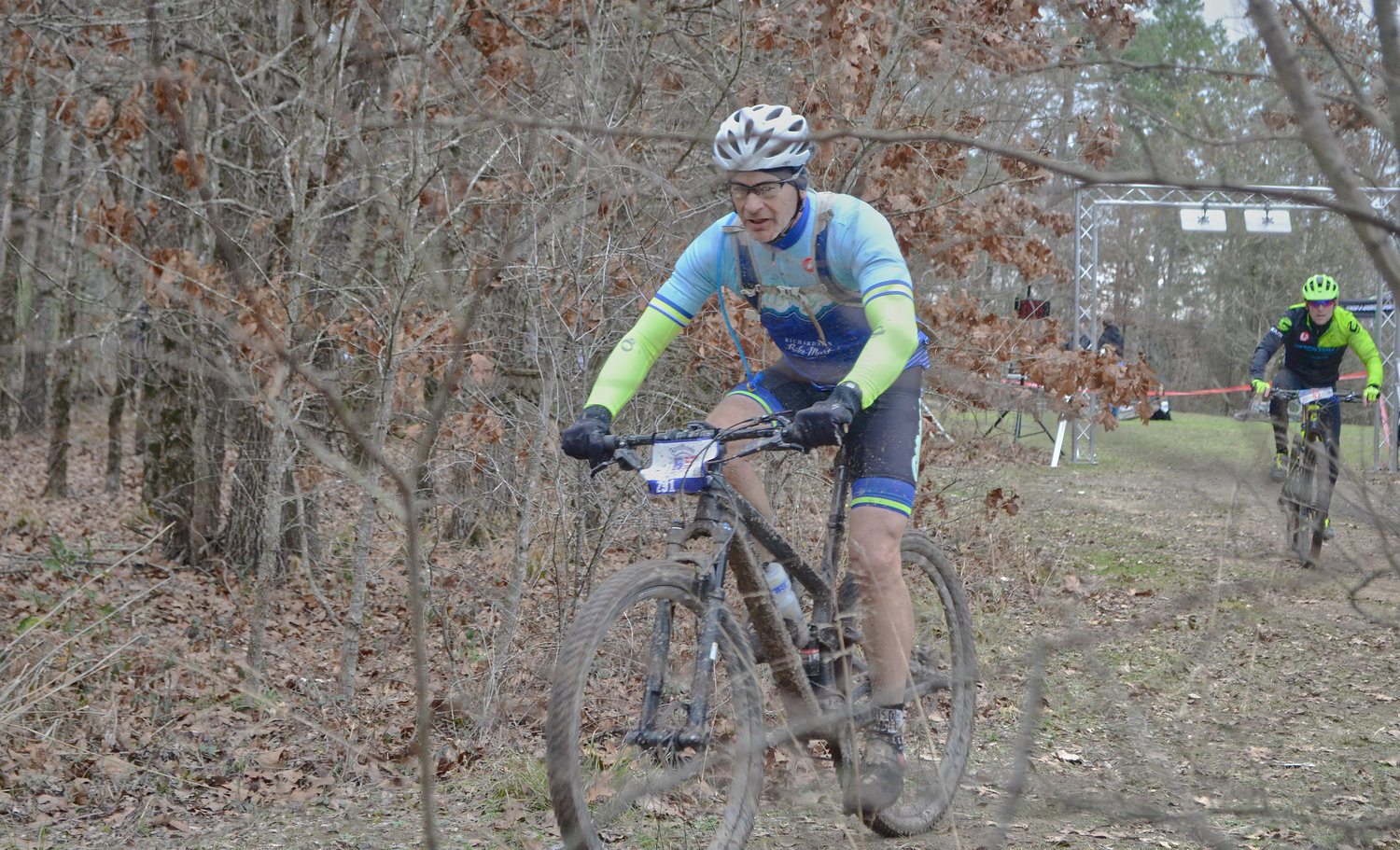 A pair of bicyclists grind out the final 15 minutes of the E150 cycling challenge Sunday at the Mineola Nature Preserve’s mountain biking course.
