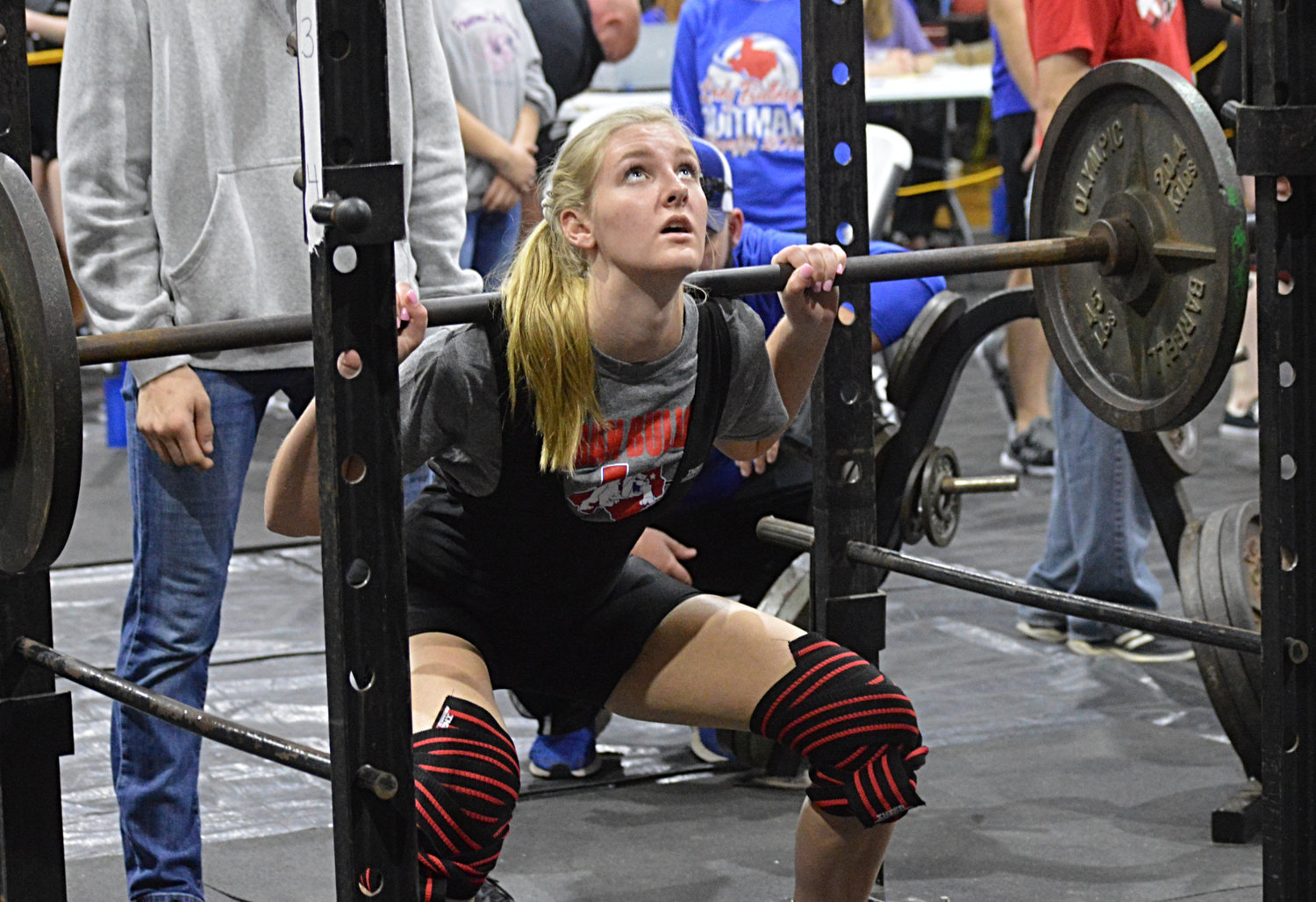 Quitman High School junior Julia Simpkins prepares to rise up with the bar during the girls power lifting competition Saturday in Quitman