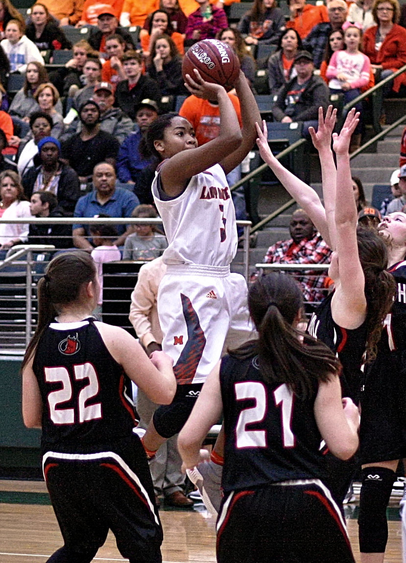 Lady Jacket standout Sabria Dean puts up two of her 28 points in semifinal action against Chapel Hill.