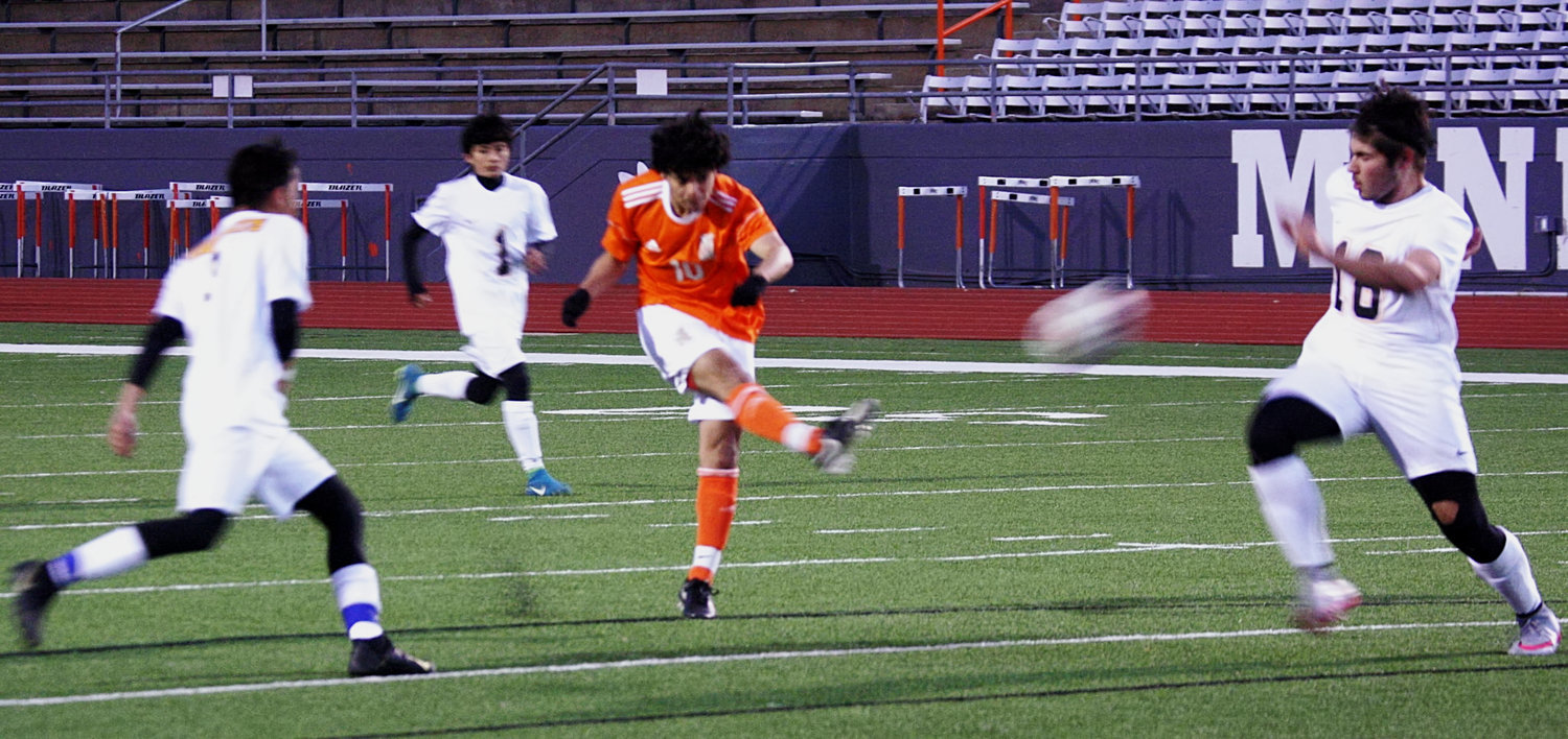 Mineola’s Alex Rojas delivers the match-winning shot against Cumberland Academy.