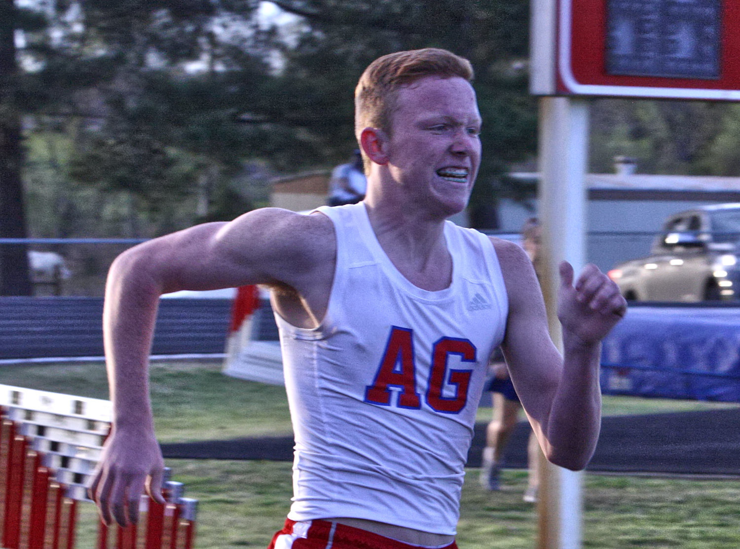 Alba-Golden’s Michael Gaskill displays the face of determination in the home stretch while competing in the Ferrell Wright Relays.