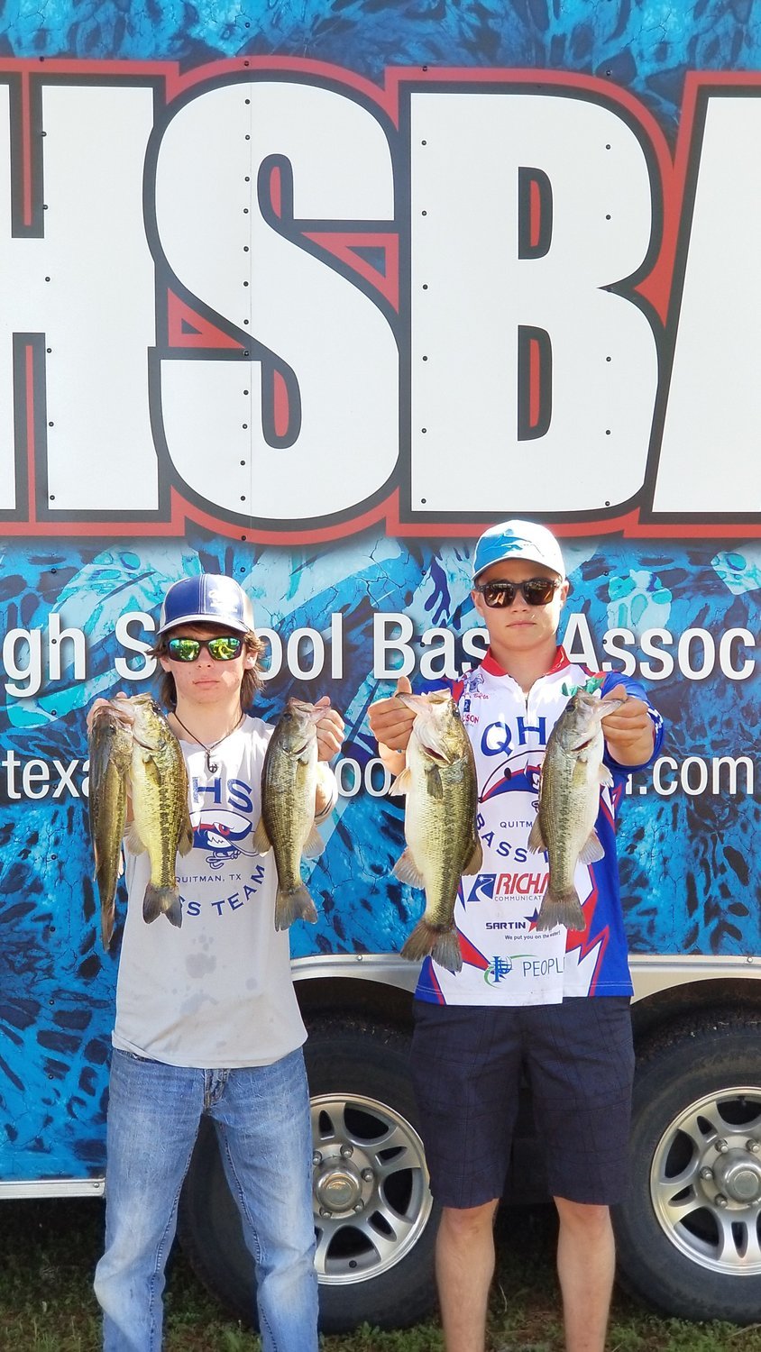 Seniors Colin “Layton” Brown (left) and Langdon Bautista and with their catches that qualified them for the state fishing tournament.