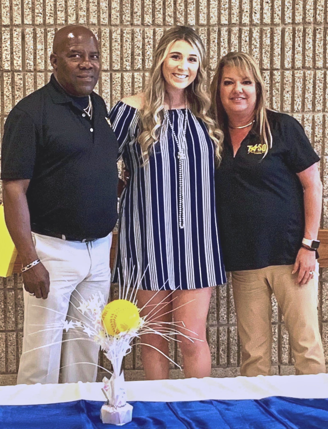 Wiley (center) pictured with Tyler Umpire Association President Oscar Strain (left) and Lisa Rockhill.