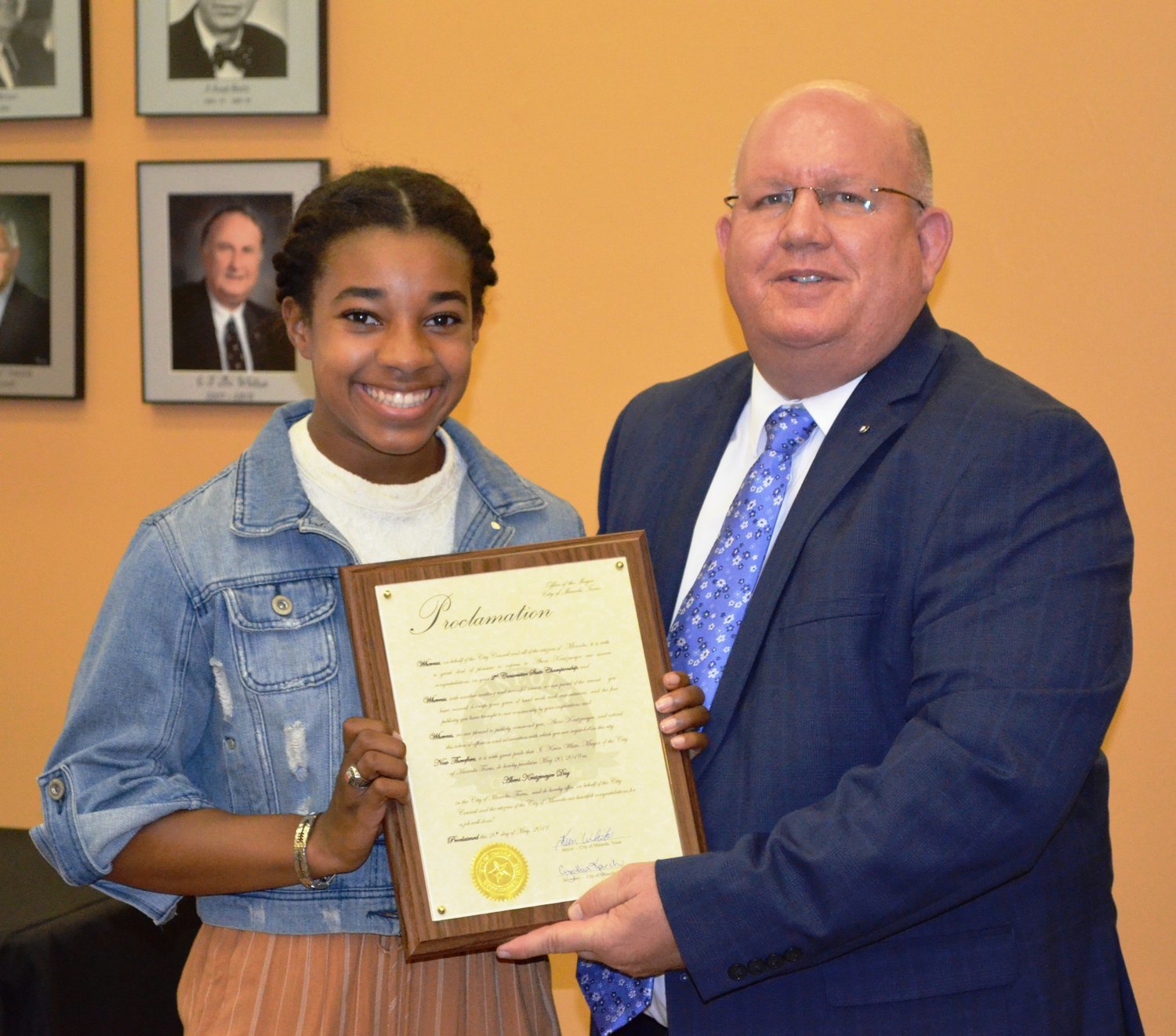 Mineola Mayor Kevin White presents a proclamation to Mineola High School’s Abeni Kratzmeyer at Monday’s Mineola City Council meeting in recognition of her second class 3A state pole vaulting title. White proclaimed Monday, May 20 as Abeni Kratzmeyer Day in Mineola.