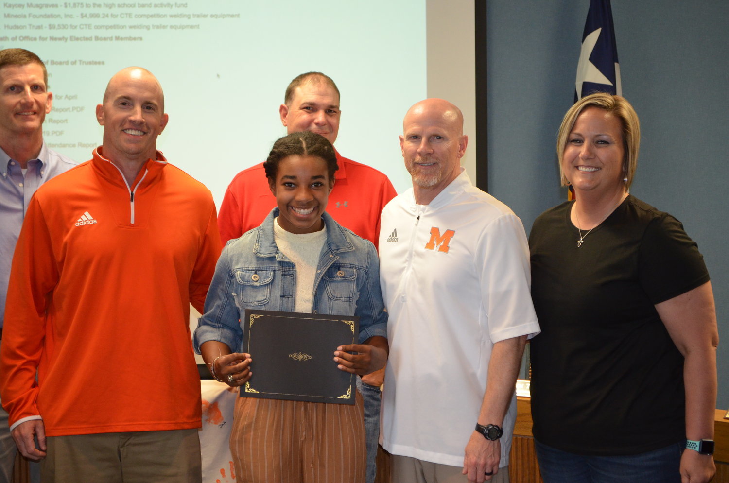 Abeni Kratzmeyer was recognized at Monday night’s MISD school board meeting for her accomplishment in repeating as class 3A state pole vault champion. Her coaches described her as a dedicated athlete as well as fine student and an exceptional person. From left are school Trustee Kyle Gully, athletic director Luke Blackwell, Kratzmeyer, Trustee Daniel Louderman, coach Bill Self, and coach Kerry Van Cleave.