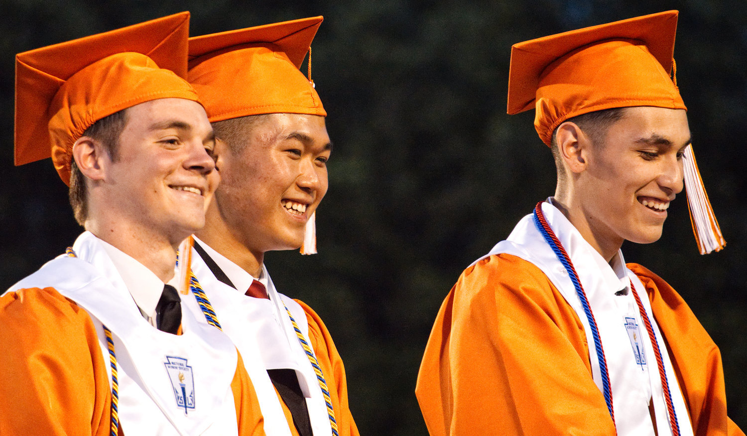 Above, from left, Jackson VanDover, Ling Dong and Rogelio Delapaz have a laugh as they give the class history for the Mineola High School Class of 2019 during Friday night’s graduation ceremony.