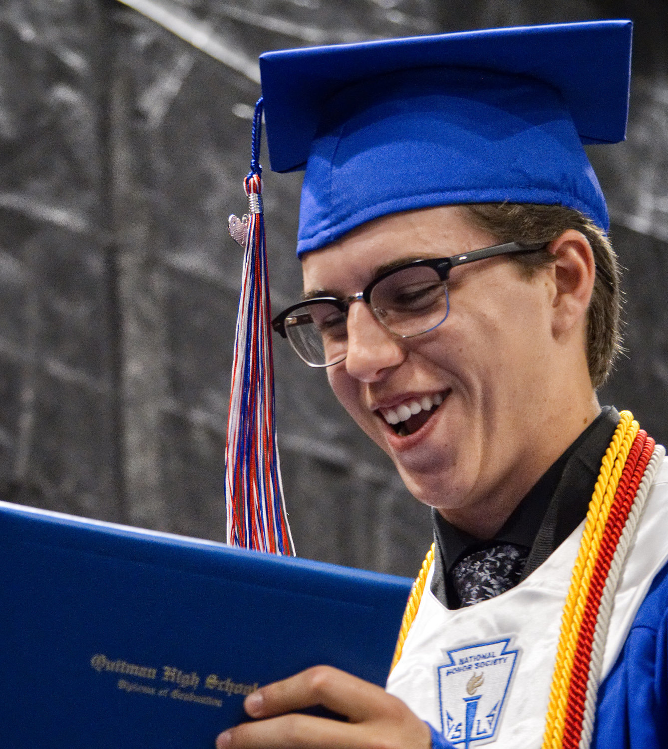 Jacob Day reacts to receiving his diploma at Quitman High School graduation.