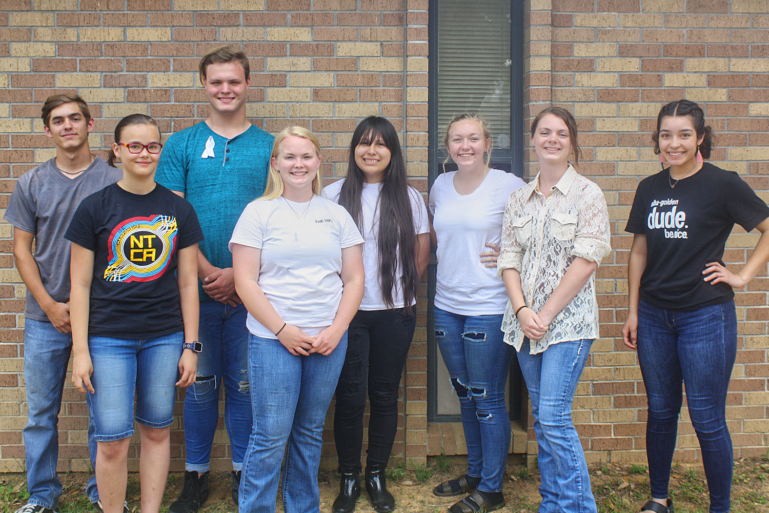 New members of the Alba-Golden color guard are, from left, Michael Kumm, Lizzie Whitecotton, Donny Humphreys, Kaya McAninch, Nayeli Camacho (co-captain), Nikki Meade (co-captain), Jasmine Weed and Fatima Cerrito.
