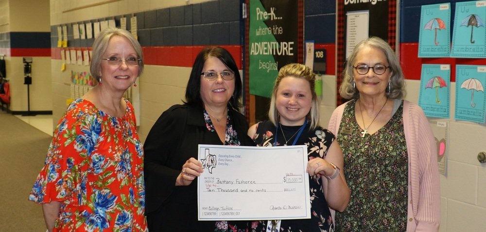 Quitman Elementary School paraprofessional Bethany Fatheree received a Grow Your Own grant award of up to $10,000 to fund the tuition costs of becoming a teacher. Pictured are (left to right) Assistant Superintendent Angela Brown, Superintendent Rhonda Turner, Bethany Fatheree and Elementary Principal Mary Ann Nichols.