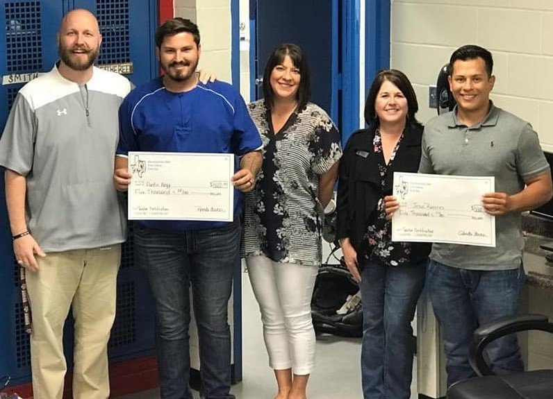 Austin Hagy, physical education teacher and coach, and Jesus Ramirez, social studies teacher and coach, each received a Grow Your Own Grant award of $5,000 to fund the tuition costs of becoming a teacher. Pictured are (left to right) Assistant High School Principal David French, Austin Hagy, High School Principal Dana Hamrick, Superintendent Rhonda Turner and Jesus Ramirez.