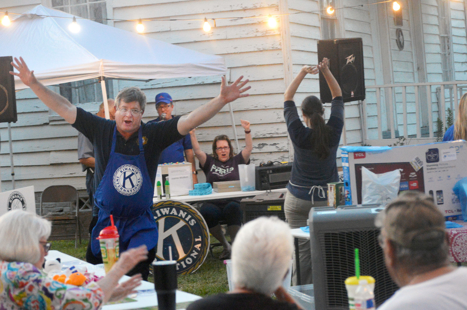 ABOVE: Dr. Randy Bennett celebrates a winner with the Bingo Wave cheer during the Quitman-Lake Fork Kiwanis Club Bingo event at the Old Settlers Reunion Saturday night in Quitman.