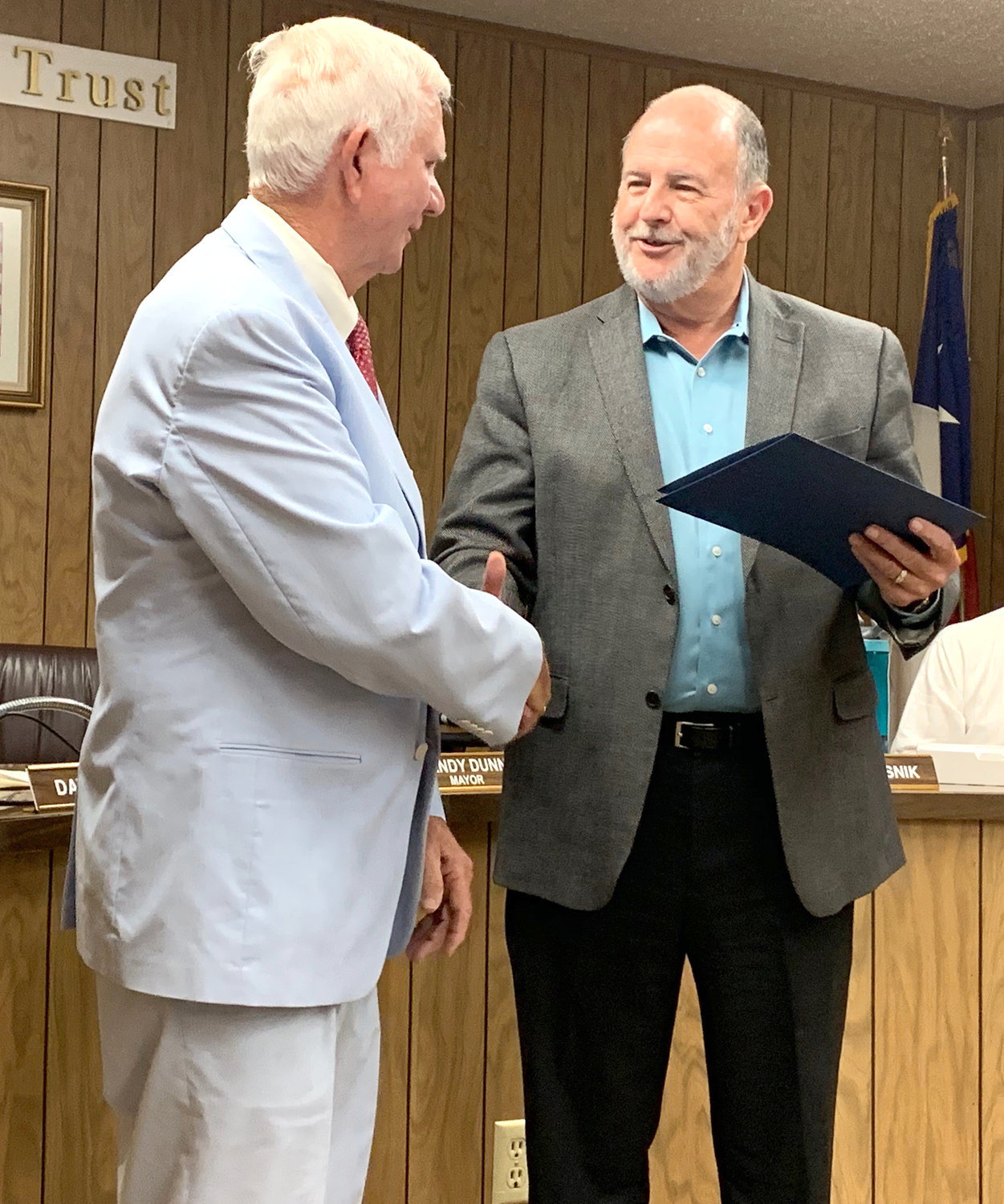 Quitman Mayor Randy Dunn (right) reads the proclamation honoring Jim Attaway for 50 years as a attorney in Texas and declaring Aug. 15 as James A. Attaway, Jr. Day at last week’s Quitman City Council meeting.