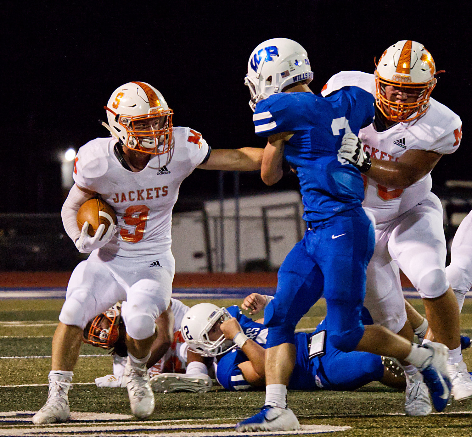 Mineola’s Cole Castleberry cuts back to follow the block.