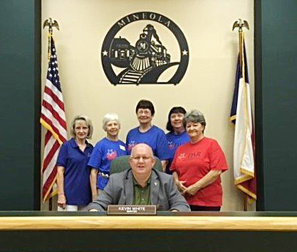 Daughters of the American Revolution (DAR) members look on as Mineola Mayor Kevin White signs the annual Constitution Week Proclamation for Sept. 17-23. DAR members are (left to right) Susan Few, Kathy Dunlap, Vera Spencer, Karen Pilgrim and Linda Haddock.