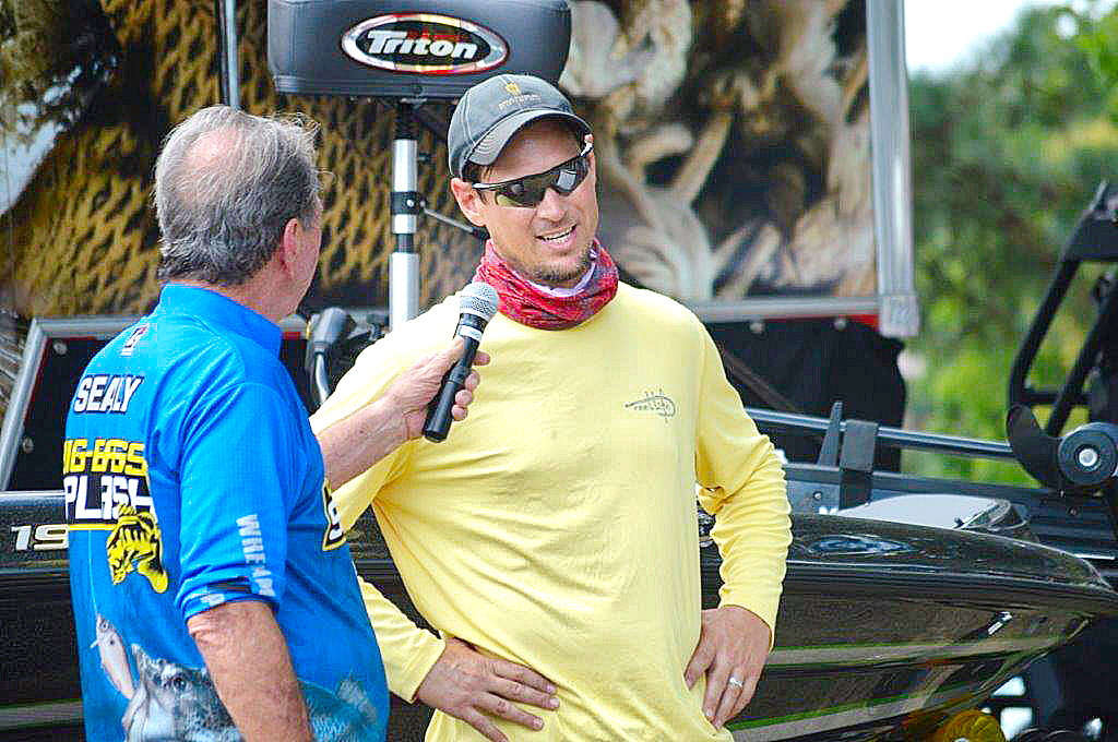 Bob Sealy (left) of Sealy Outdoors interviews Big Bass Splash winner Blake Harvey. Harvey’s catch of a 10.61 bass was the top prize winner at the annual event.