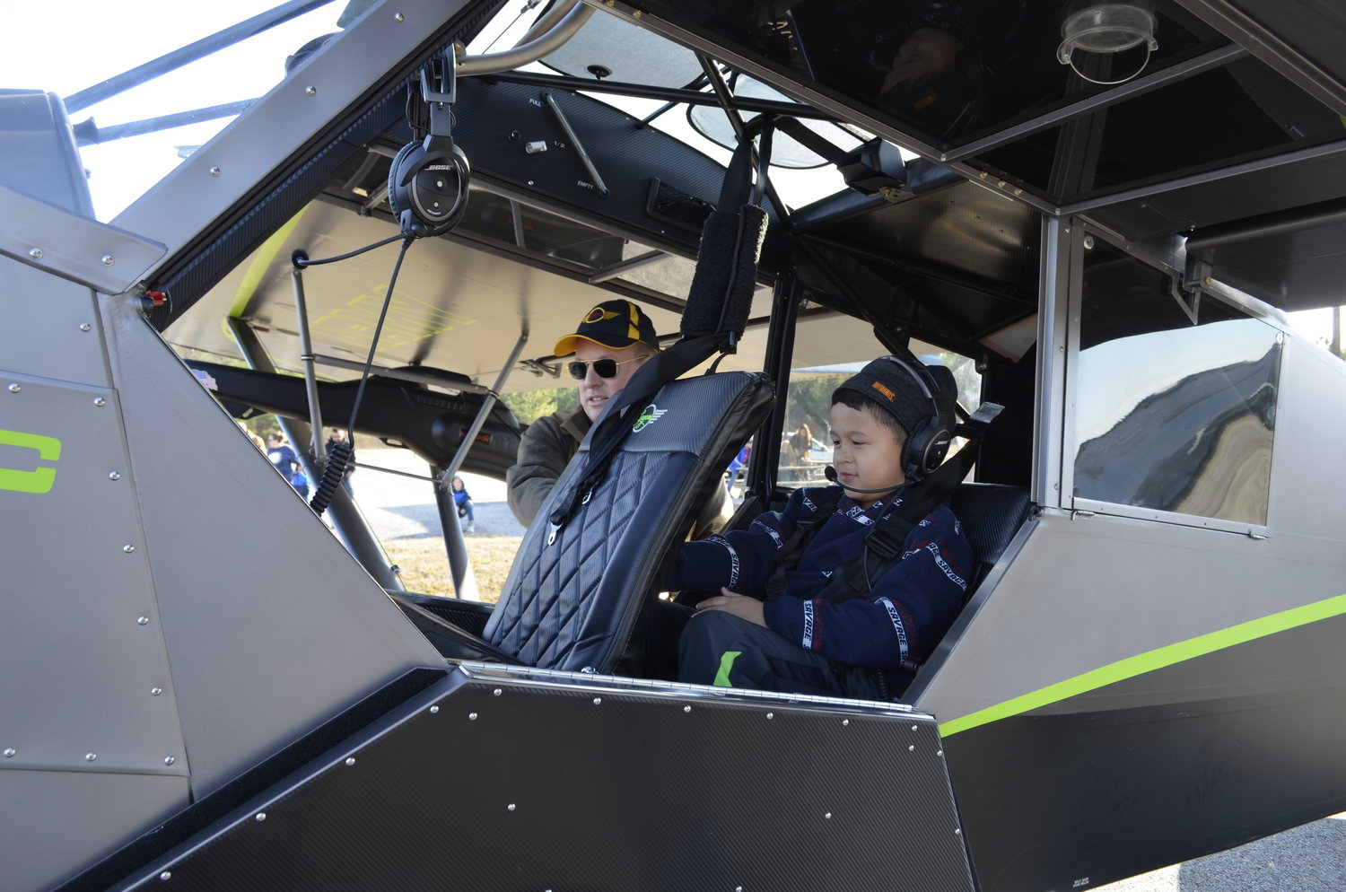 Scout Elias Zavala gets buckled in and ready to take flight with Dr. Wisdom as part of the Young Eagles Program. (Monitor photo by Amanda Duncan)