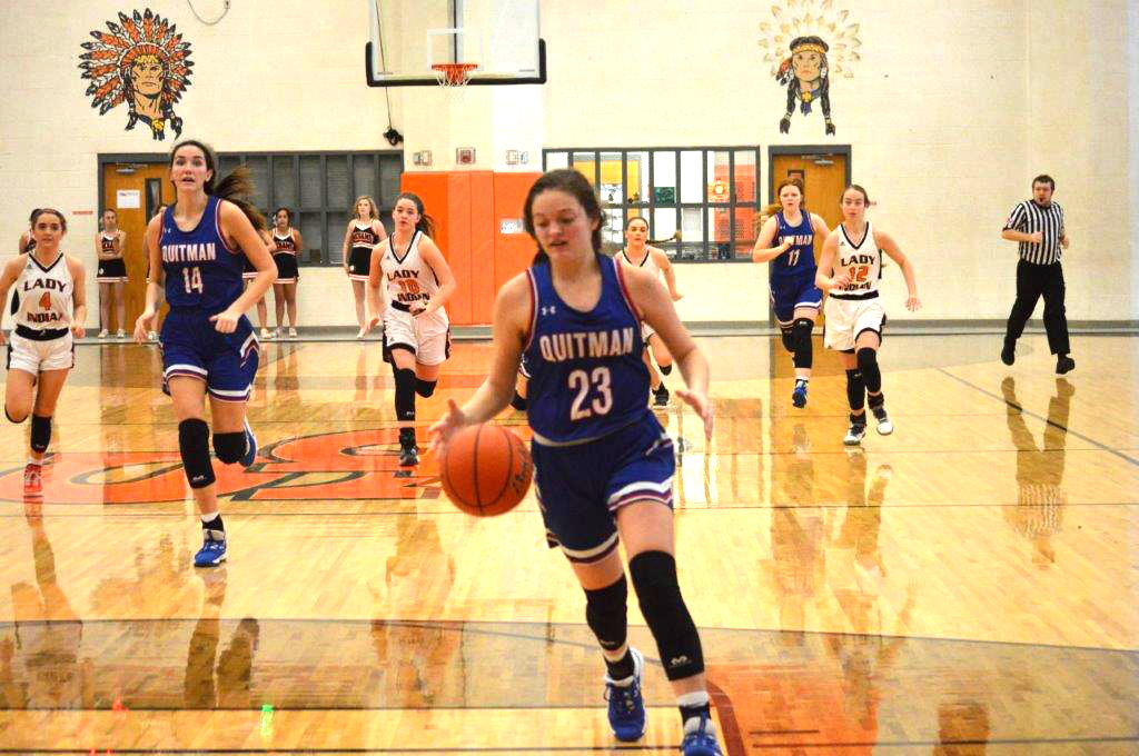 Quitman’s Madison Pence (23) drives in to score two of her seven points in the Lady Bulldogs 48-34 win at Grand Saline.