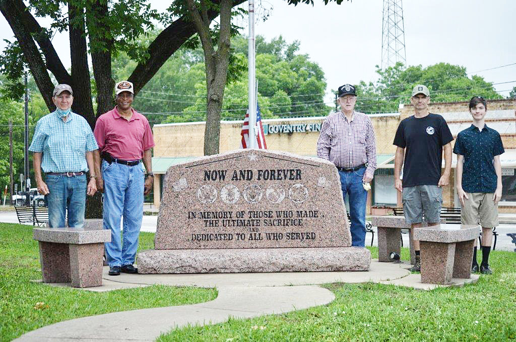 Although the annual Memorial Day services sponsored by the Wood County Veteran’s Committee at the courthouse monument was canceled, these men wanted to make sure the fallen soldiers of United States armed forces were honored by raising the flags Monday morning. They are (from left) Jim Attaway (Army), Bobby Grant (Army), Lee Roy Harper (Navy), Jason Attaway (Army) and Jason Attaway, Jr.