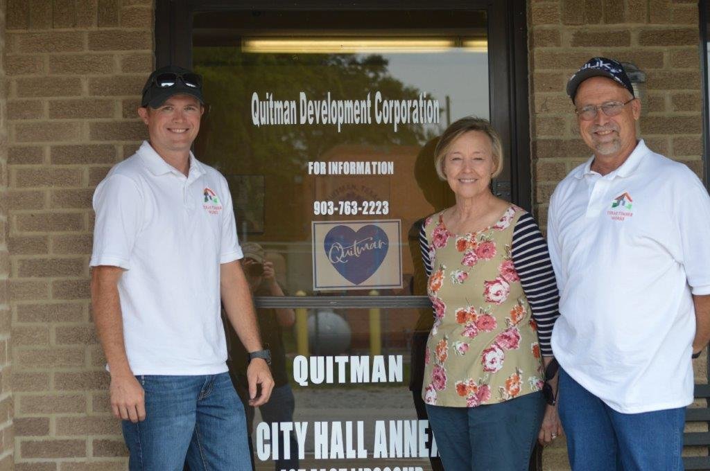 Texas Timber Works is coming to the Quitman Business Park. The father-son owners met with Quitman Development Corporation President Martha Scroggins last week to work on the final paperwork. Pictured (left to right) are Jeremy May, Scroggins and Shaun May. (Monitor photo by Larry Tucker)