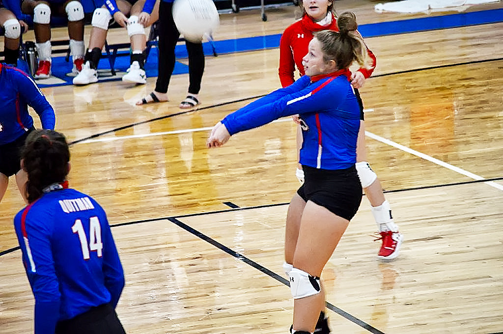 Quitman’s Carley Spears defends against a serve to the backline in last Friday’s contest against Tyler HEAT in Hawkins. (Monitor photo by Larry Tucker)