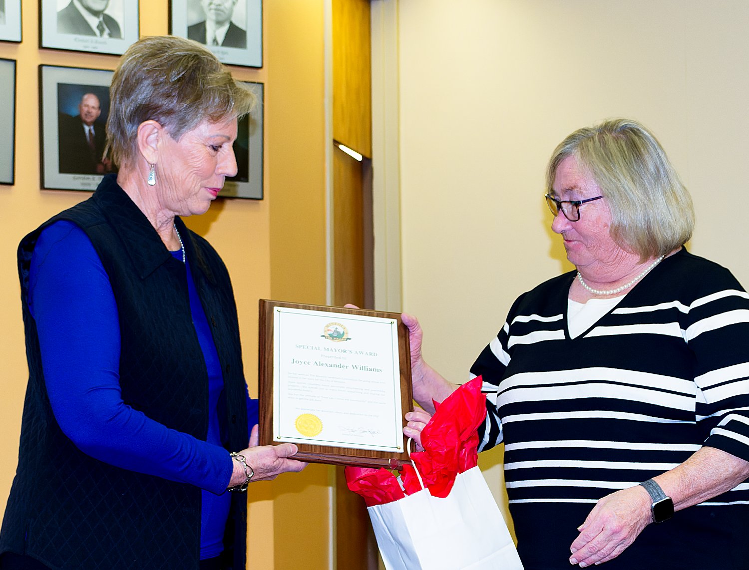 Mineola Mayor Jayne Lankford, right, presented a special award Monday to Joyce Williams for the retired teacher’s volunteer efforts throughout the city, especially concerning historic Mineola and the Iron Horse Square Park.