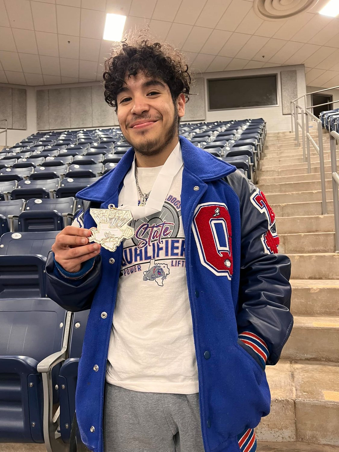 Carlos Flores of Quitman High School brought home the silver medal in his 114-pound weight class Friday at the state powerlifting meet in Abilene.
