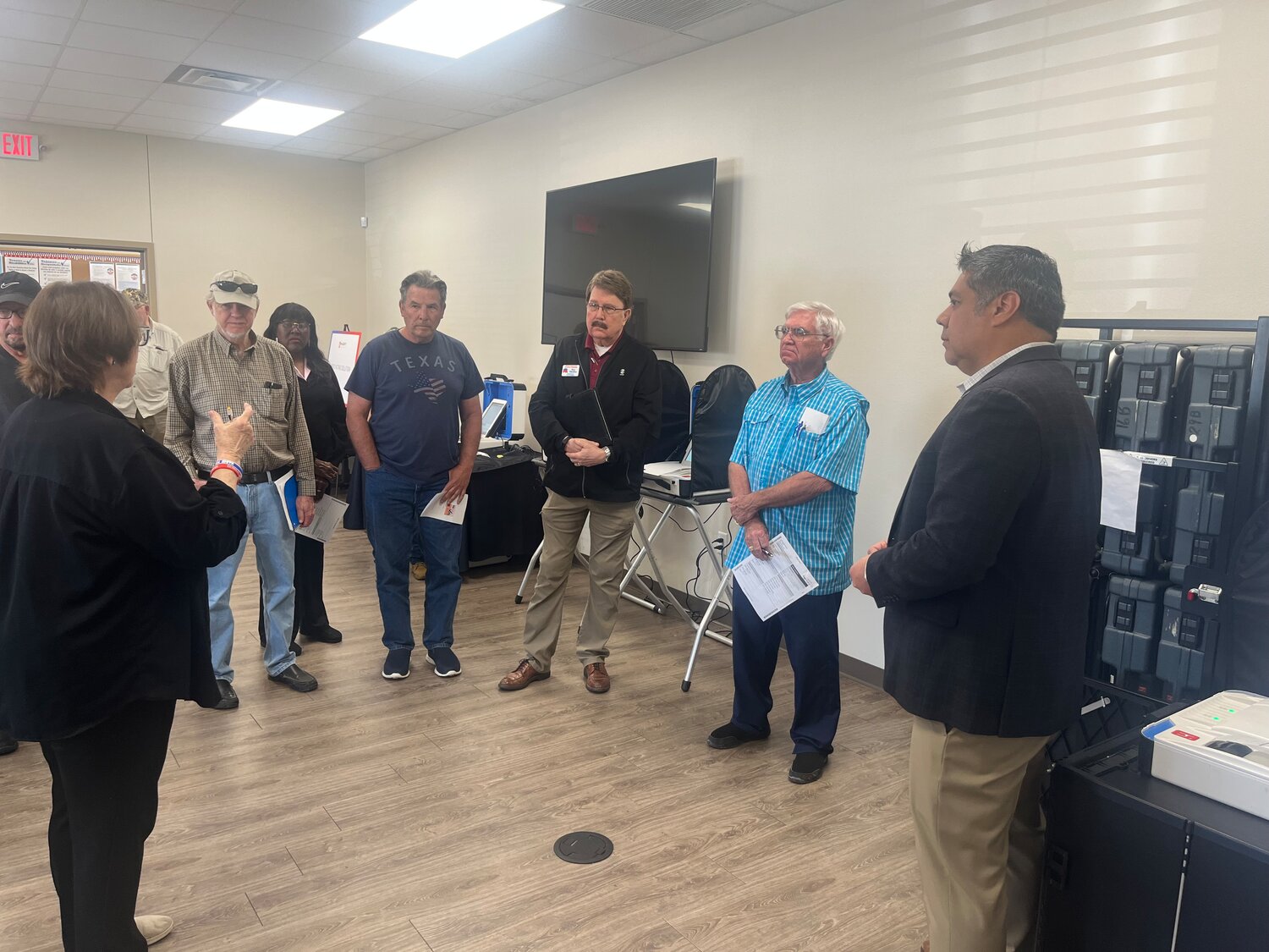 Tony Cervantes (far right) from the Hart InterCivic listens to Wood County voters during a discussion last Thursday concerning voting machines at the elections office meeting room.