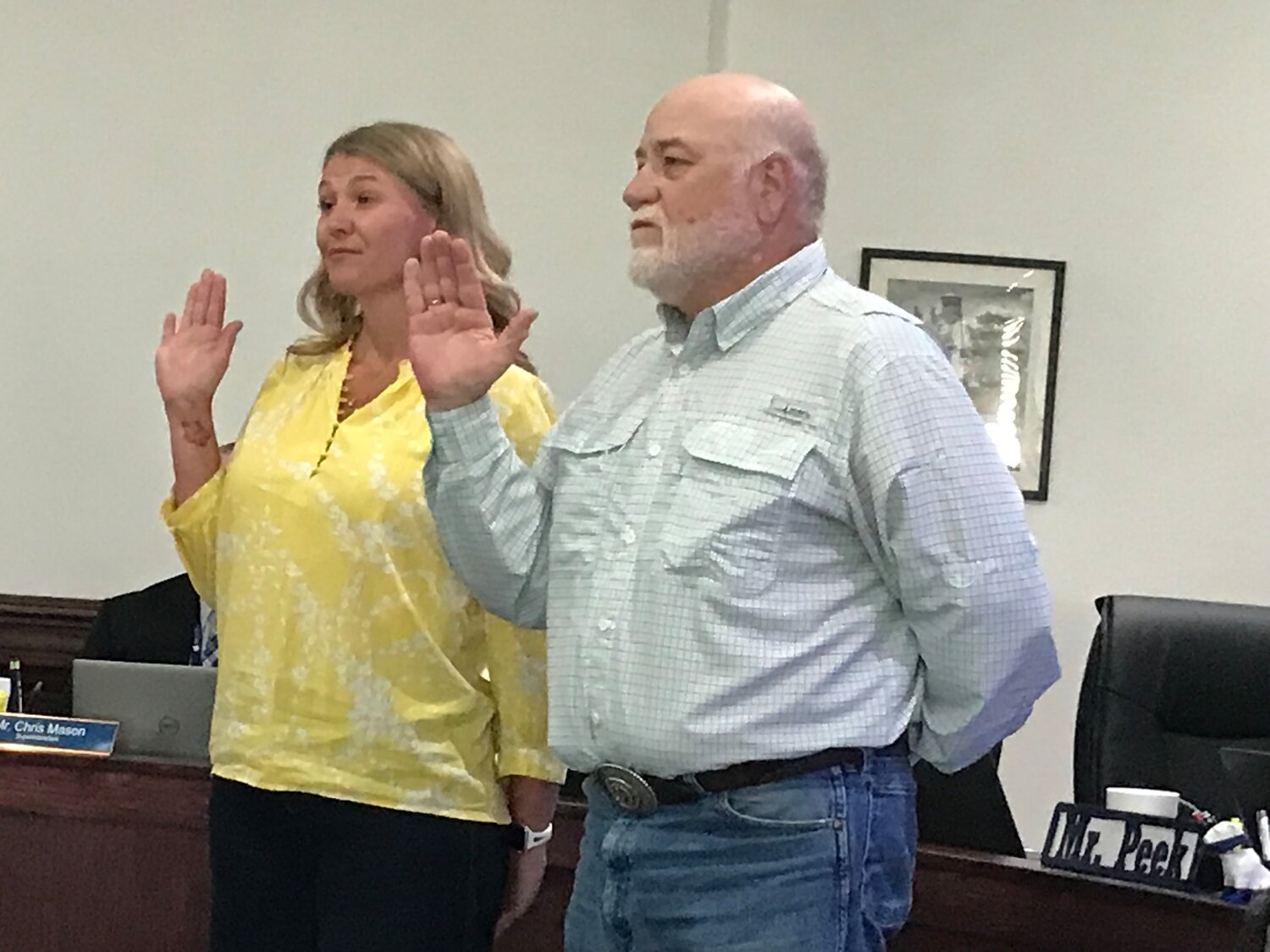 Quitman School Board members Vanessa Simpkins and James Hicks take the oath of office at last week’s board meeting.