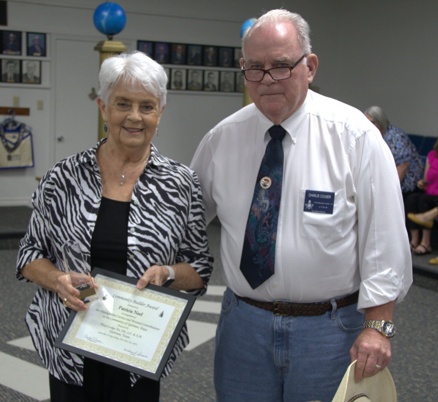 Patricia Neel is congratulated by Worshipful Master Charlie Couser.