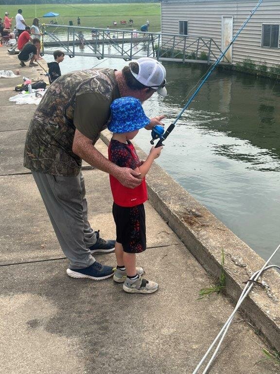Noble Langford gets some instructions from his Dad, John Langford, at Saturday’s annual KidFish tournament held at Lake Fork.