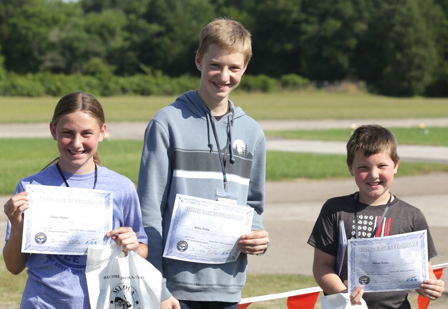 Claire, Miles and Oliver Potts of Mineola with their Young Eagle certificates.