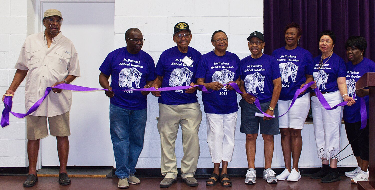 Participating in the ribbon cutting to open the new McFarland School museum are, from left, James Anderson, Billy McCalla, Joe Epperson, Shirley Roberson, Haywood Epperson, Valerie Palmer, Odessa Slayton and Jackie McCalla.
