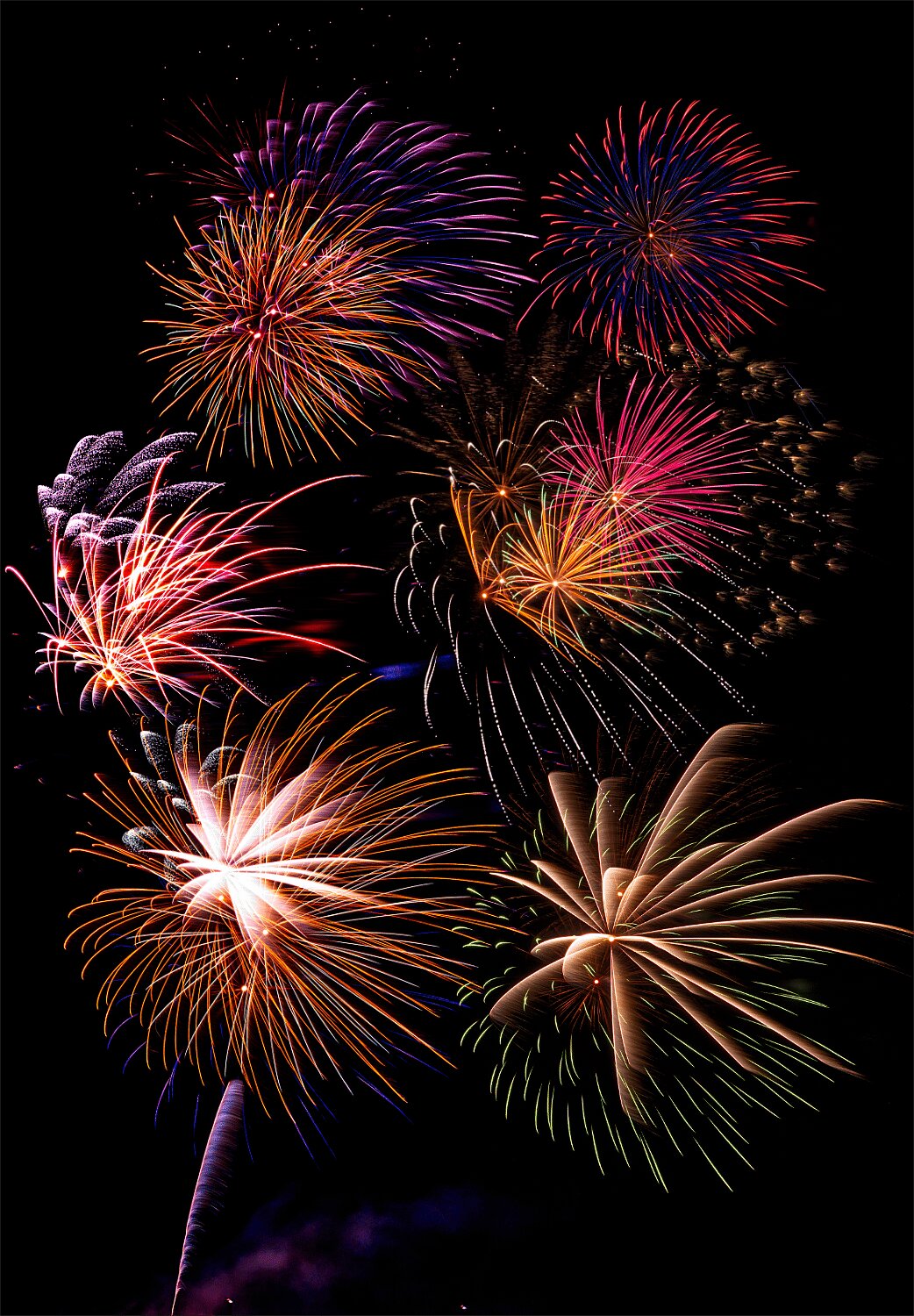 A composite of six separate photos gives an idea of the range of colors experienced by those present at Mineola's annual Independence Day fireworks show.