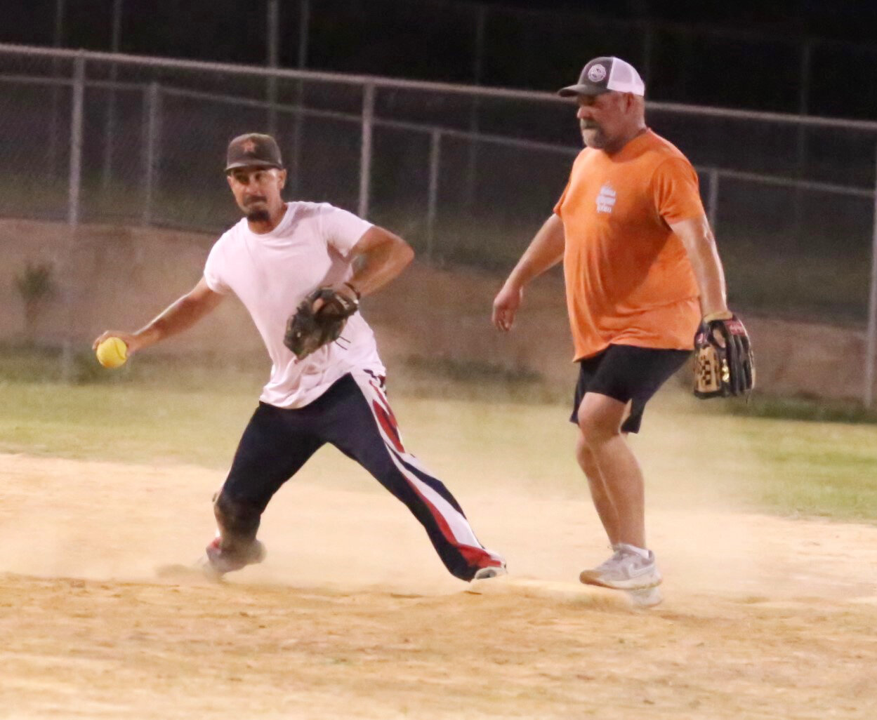 Mineola Fire Department shortstop Justin Clower (left) steps on second for a force out. Second baseman Eric Carrington was ready to take a throw on the play.