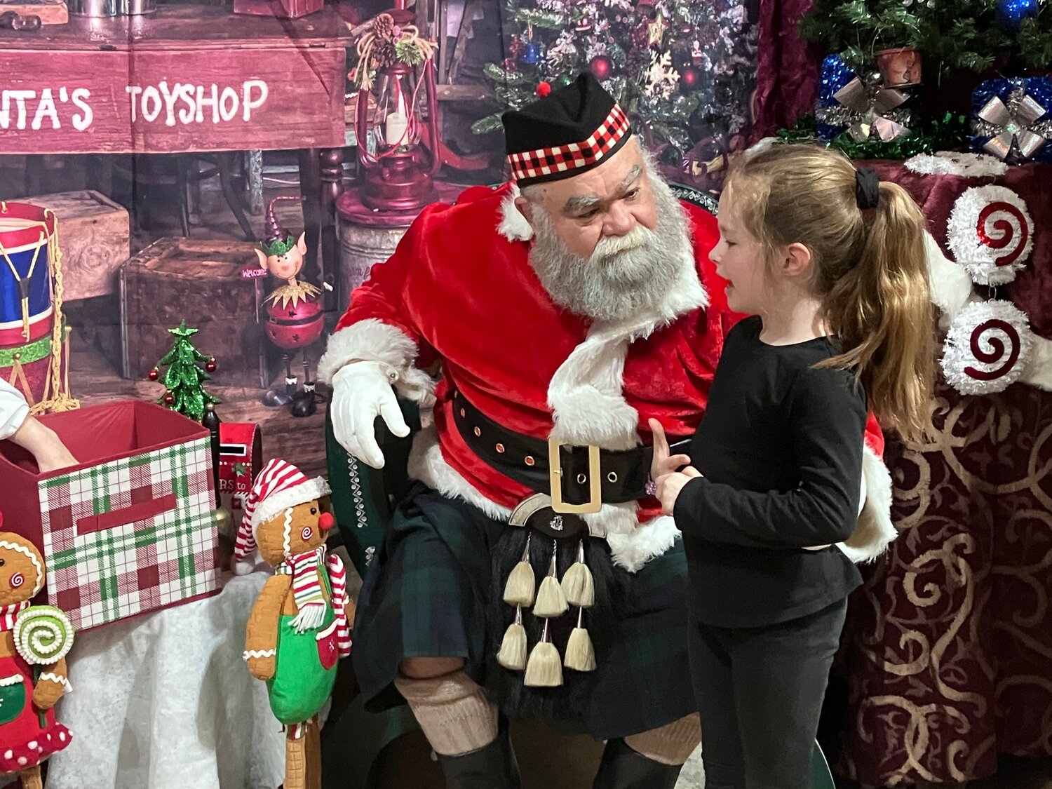 Grace visits with the Celtic Santa.