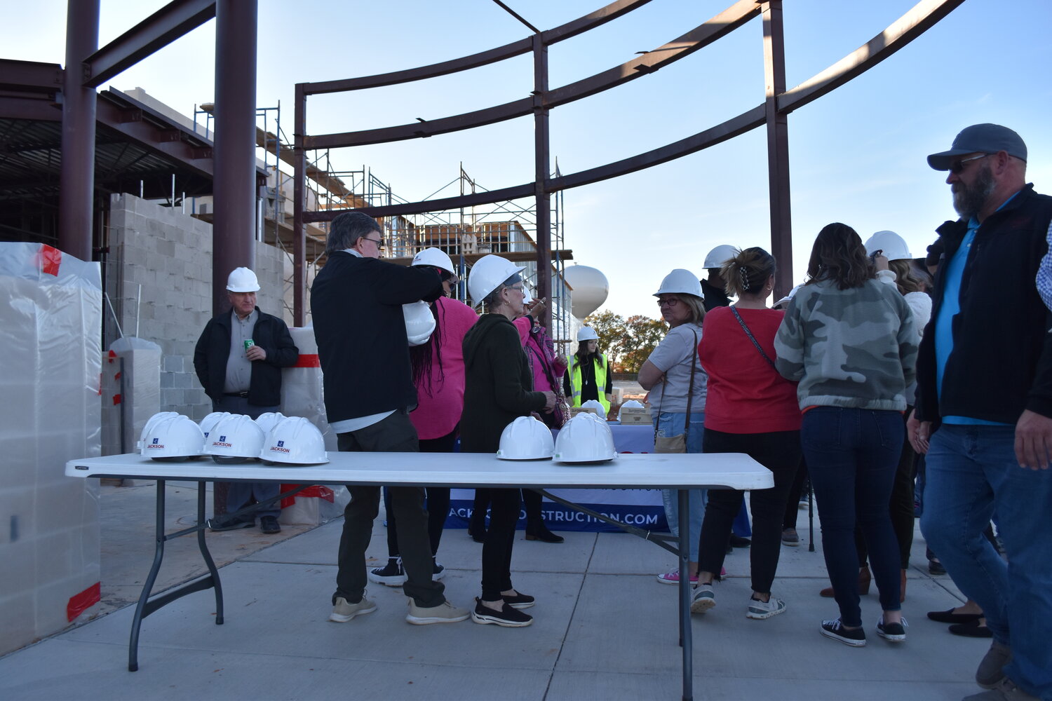 Community members don hard hats for a tour of the new Mineola Primary School under construction on NE Loop 564.