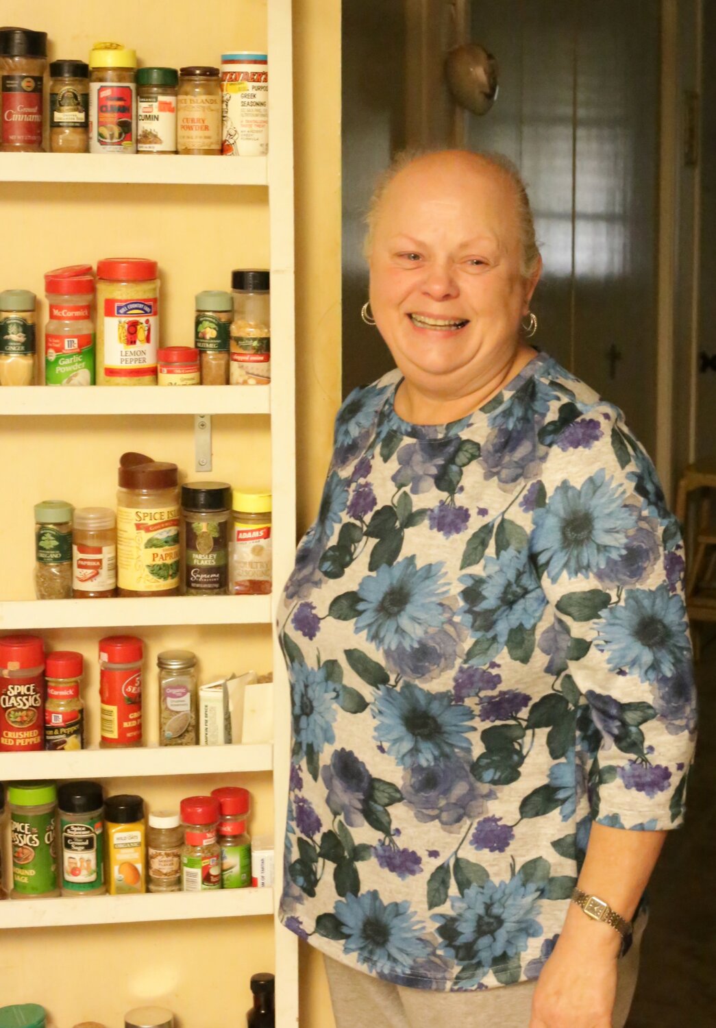 Kathy Driver stands at her spice rack in her Newsom St. home.