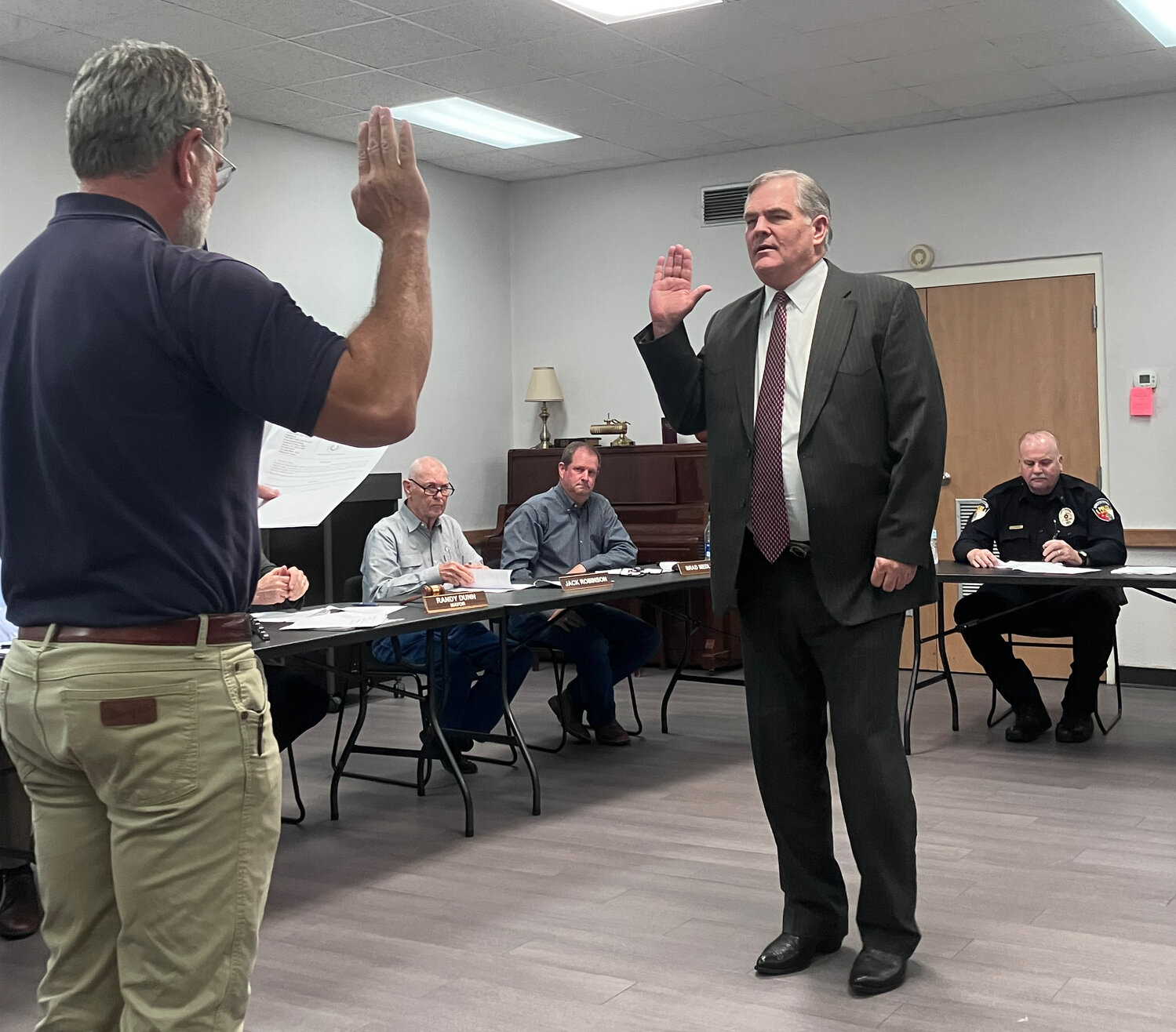 New Quitman associate municipal judge Michael King, right, is sworn in by City Administrator James Attaway at last Thursday’s city council meeting.