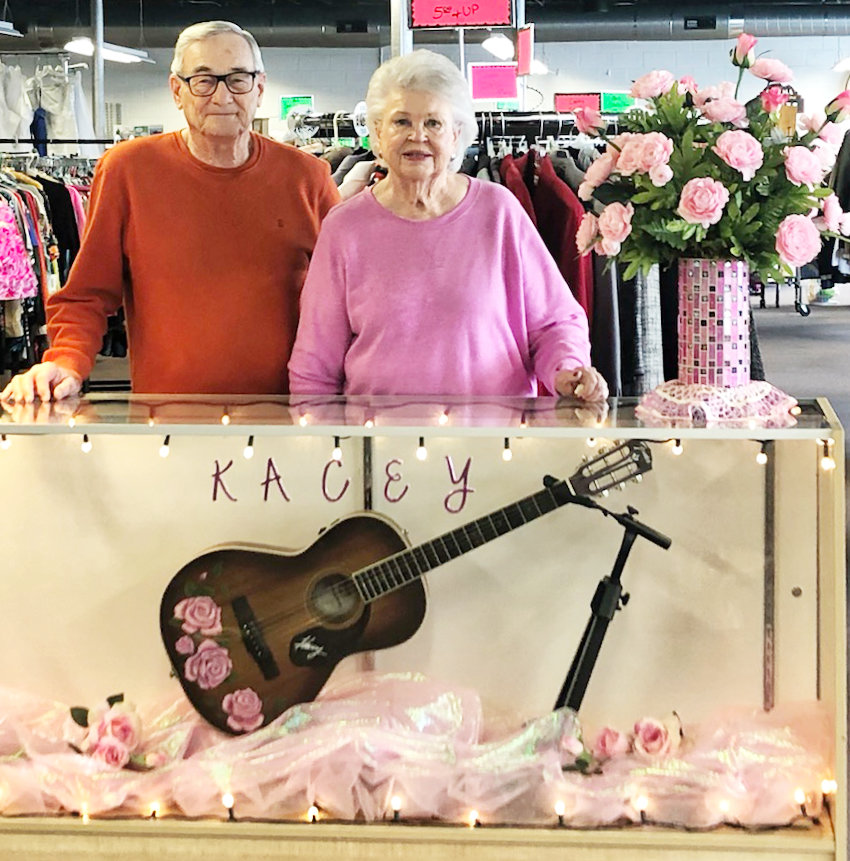 Darrell and Barbara Musgraves show the custom painted and signed guitar from their granddaughter, Kacey, that will be awarded to a lucky winner to benefit the Kindness Kottage in Mineola.