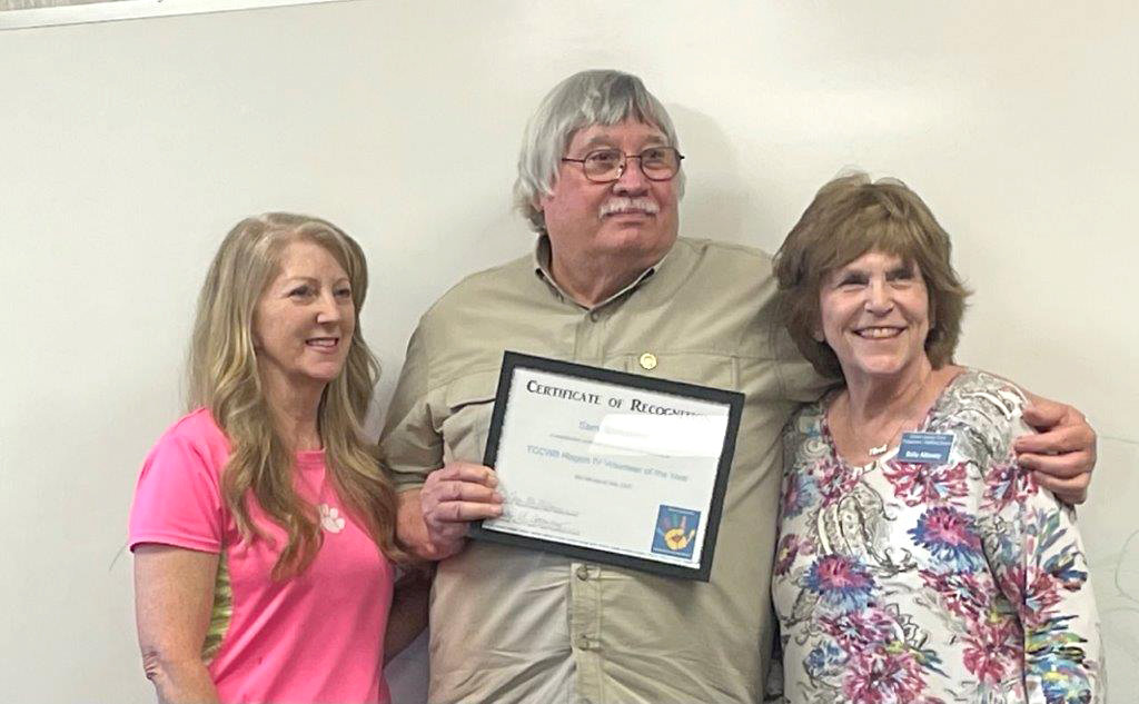 Sam Scroggins (center) received recognition as the Texas Council of Child Welfare Board Region IV volunteer of the year. Also pictured are JoAnne McMillan (left), incoming Wood County Child Welfare Board president, and Wood County Child Protection Board President Sally Attaway.