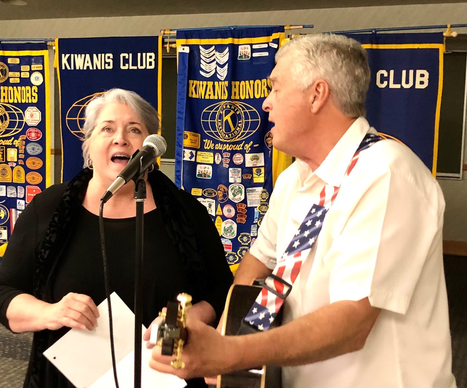 Nancy Murphy and Jay Horton perform at a recent meeting of the Mineola Kiwanis Club.