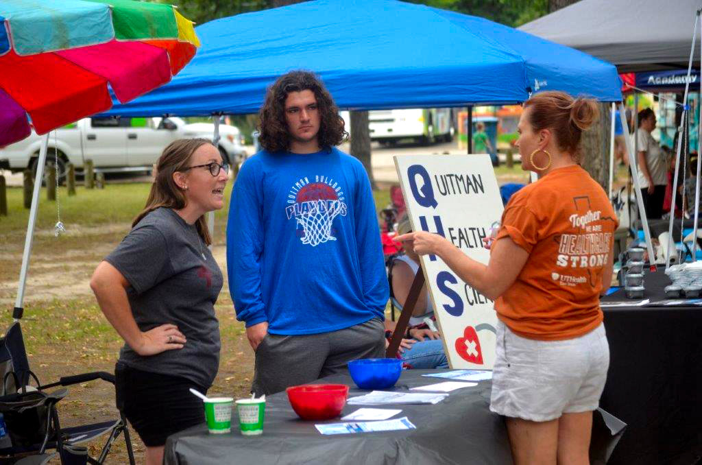 The Quitman High School Health Science program was on hand at the UT Health Fair Saturday at Jim Hogg City Park. Quitman educator Brittany Emerson (left) and student Hayden Batchelder speak with Christi Floyd during the health fair.