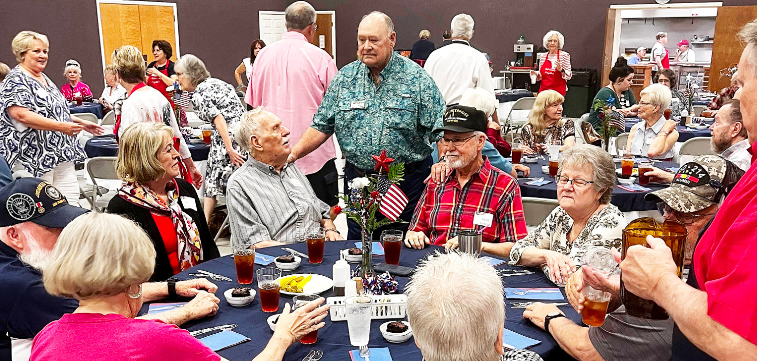 Area veterans and their families gather for a meal as part of the Lake Country Neighbors annual salute to veterans held recently at Lake Fork Baptist Church.