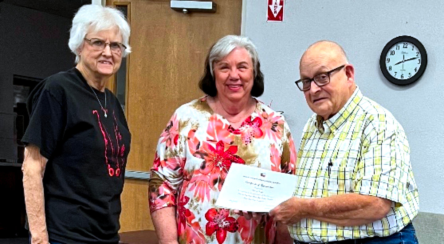 Presenting Deason Hunt with a certificate of appreciation (from left) is Shirley Patrick, secretary/treasurer; Karen Pilgrim, president; and Hunt.