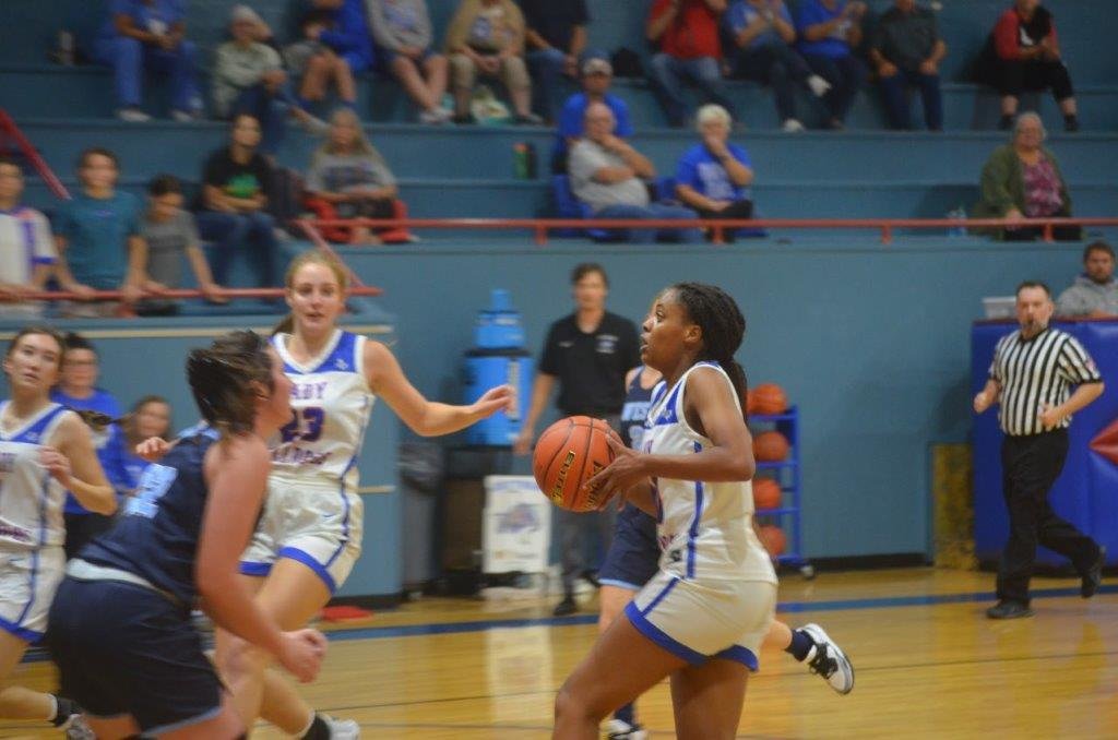 Quitman’s Allie Berry drives the lane and scores two of her game high 12 points in the Lady Bulldog’s 39-30 win to open the season last Tuesday evening.