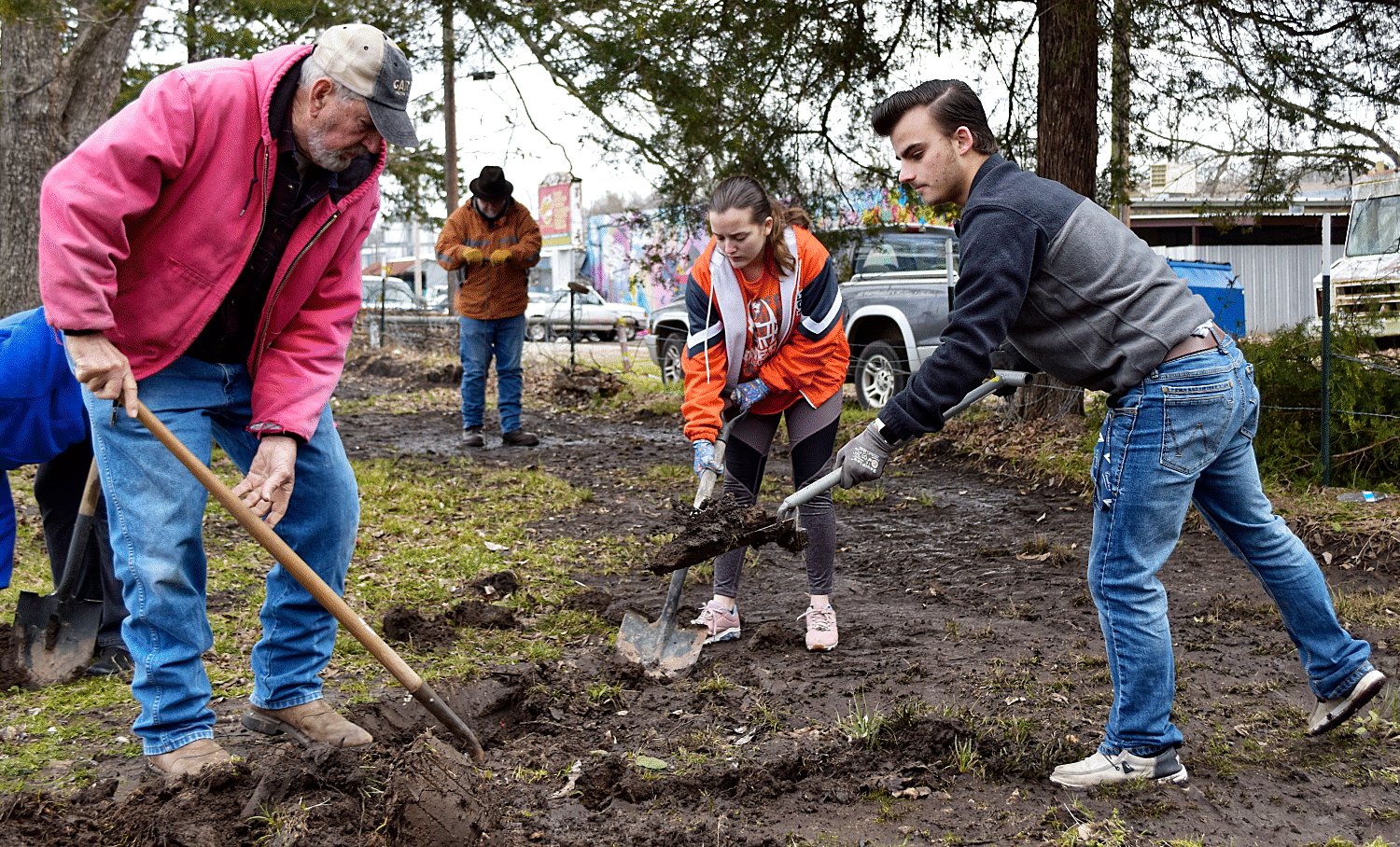 Floyd Kent, from left, Brittani Christofferson and Cameron Bussell dig in a spot identified by probing the soil and uncovered a trash pile at the former Bailey Hotel site.